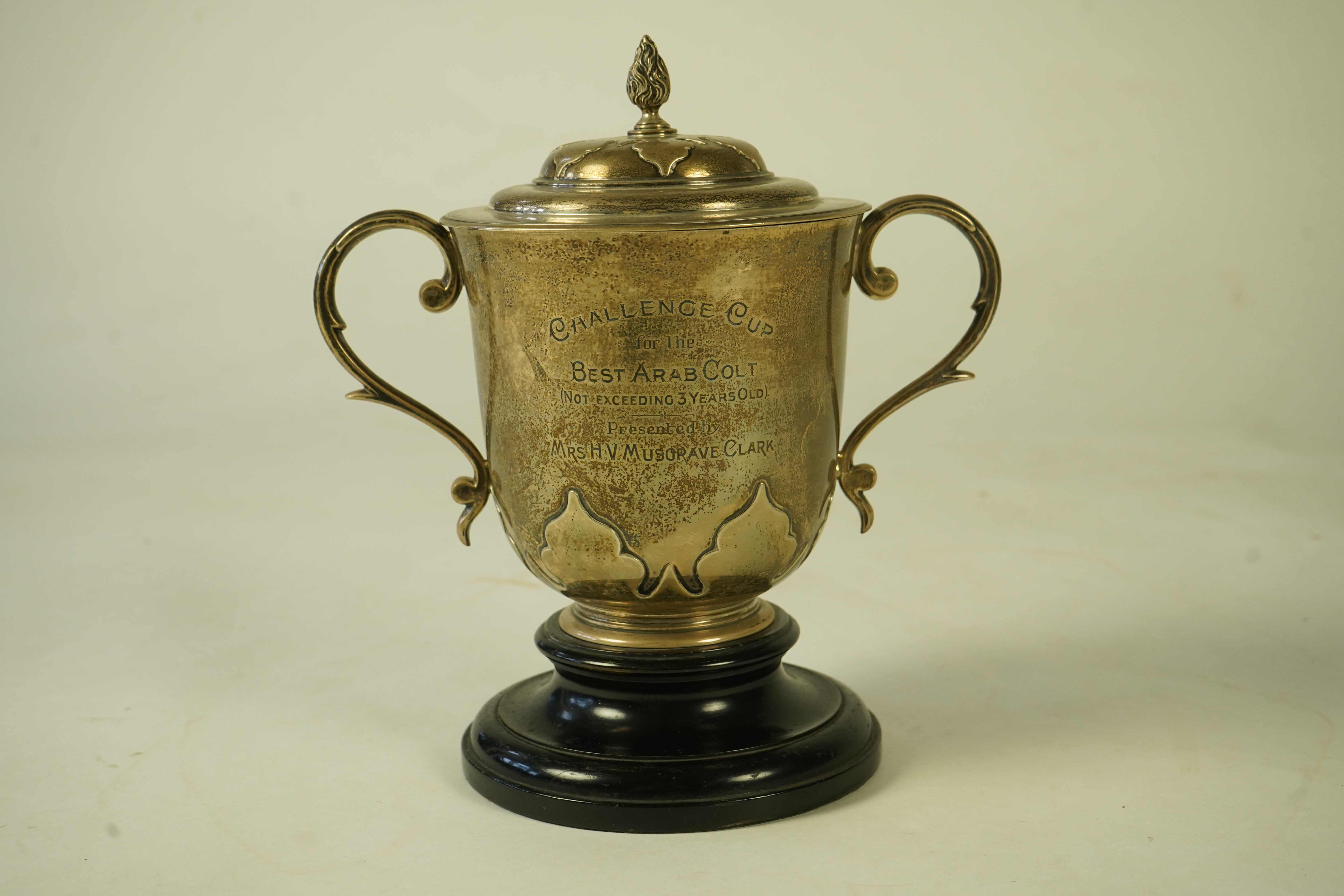 A George V silver two handled presentation cup and cover by Johnson, Walker & Tolhurst, with later engraved horse racing inscription relating to 'The Arab Horse Society Challenge Cup for the Best Arab Colt'